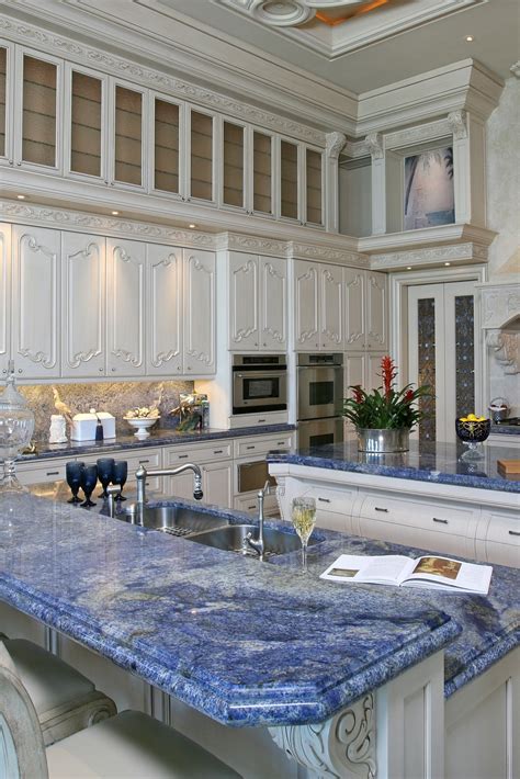 white marble countertops blue cabinets